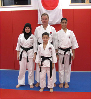 Three new black belts; Youcef, Ahmed & Aneesah Azzouz with Sensei Martin. Well done the whole family, especially their Mother.